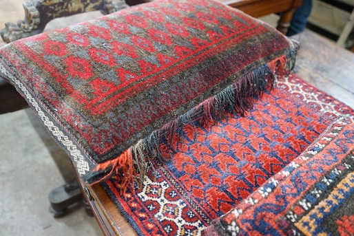 Two Caucasian cushions, larger 67 x 45cm together with a bag face